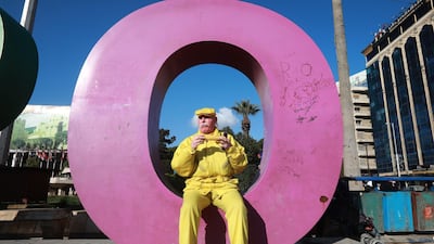 Abu Zakkour, Aleppo's so-called yellow man, eats a cob of corn at Saadallah al-Jabiri square in the northern Syrian city. AFP