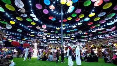 Visitors enjoy the evening at Sheikh Zayed Heritage Festival in Al Wathba, Abu Dhabi, on New Year's Eve. Victor Besa / The National