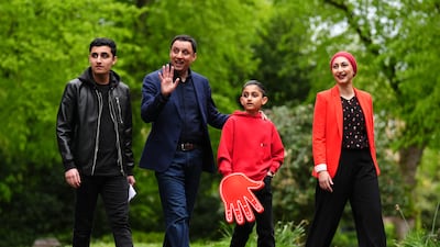 Scottish Labour leader Anas Sarwar arrives with his family to vote at Pollokshields Burgh Hall, Glasgow. PA