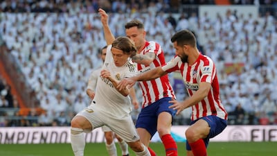 Real Madrid's Luka Modric battles for the ball on Saturday. Reuters