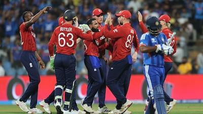 England spinner Adil Rashid celebrates with teammates after taking the wicket of India's Ishan Kishan. Reuters