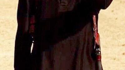 An image grab taken from a video released by the Islamic State (IS) and identified by private terrorism monitor SITE Intelligence Group on September 2, 2014 purportedly shows a masked militant holding a knife and gesturing as he speaks to the camera in a desert landscape before beheading 31-year-old US freelance writer Steven Sotloff. The United States has identified the masked Islamic State militant who murdered Sotloff and US journalist James Foley in separate videotaped beheadings, FBI chief James Comey said on September 25, 2014. “We believe we have identified the executioner,” Comey told reporters at a briefing in Washington. “I won’t tell you who it is.” AFP photo