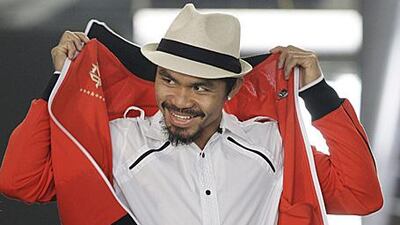 Manny Pacquiao arrives for a press conference at Cowboys Stadium in Texas.