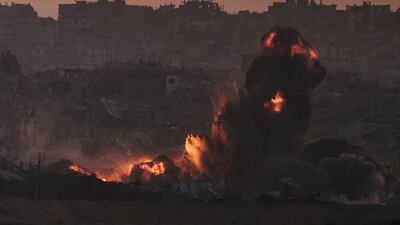 The aftermath of an Israeli air strike in the northern Gaza Strip, as seen from southern Israel on July 18. AP