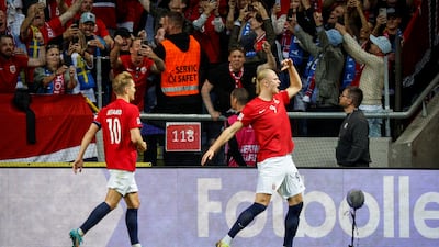 Soccer Football - UEFA Nations League - Group H - Sweden v Norway - Friends Arena, Solna, Sweden - June 5, 2022 Norway's Erling Braut Haaland celebrates scoring their first goal with Martin Odegaard Christine Olsson/TT News Agency via REUTERS ATTENTION EDITORS - THIS IMAGE WAS PROVIDED BY A THIRD PARTY. SWEDEN OUT. NO COMMERCIAL OR EDITORIAL SALES IN SWEDEN.