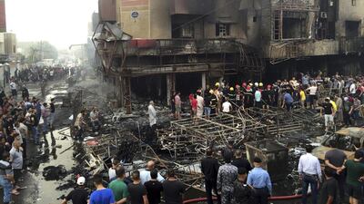 Iraqi security forces search for victims after an explosion at the Karrada shopping district in Baghdad on July 3, 2016. Khalid Mohammed / Associated Press