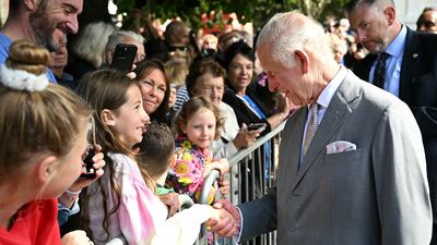 King Charles greets a member of the public after visiting Southport Town Hall. Reuters