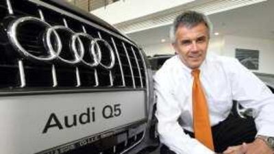 Peter Schwarzenbauer, Audi AG member of the board for Sales and Marketing with the new Q5 at the Audi showroom on the Corniche in Abu Dhabi.