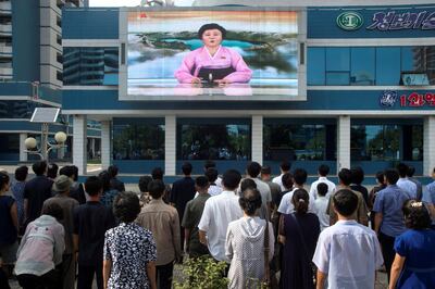 Residents watch a big video screen on Mirae Scientists Street in Pyongyang showing newsreader Ri Chun-hee announcing the news that the country has successfully tested a hydrogen bomb on September 3, 2017. Kim Won-jin/AFP Photo
