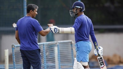 India cricket team batting coach Sanjay Bangar, left, talks to Stuart Binny during a training camp at the National Cricket Academy in Bangalore, India, Saturday, July 2, 2016. Aijaz Rahi / AP Photo