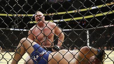 Brock Lesnar smiles after defeating Mark Hunt during their heavyweight bout at UFC 200, Saturday, July 9, 2016, in Las Vegas. John Locher / AP Photo