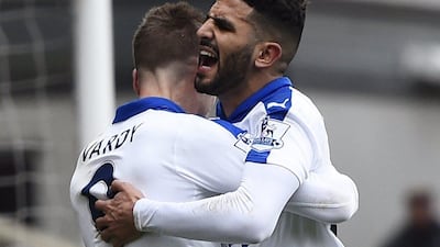 Riyad Mahrez celebrates with Jamie Vardy after scoring the first goal for Leicester City. Reuters / Dylan Martinez