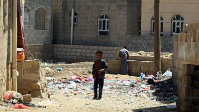 A Yemeni child walks past rubbish on a street amid a cholera outbreak in Sana. EPA