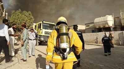Sharjah Civil Defence work on containing a fire at a mattress factory in Industrial Area 10, Sharjah. Antonie Robertson / The National