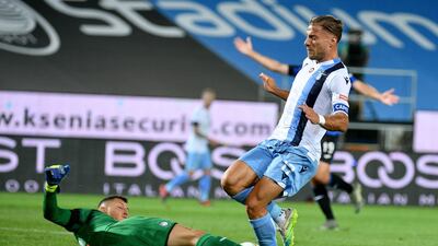 Ciro Immobile of Lazio competes for the ball with Pierluigi Gollini of Atalanta. Getty