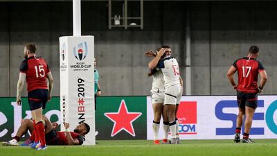 United States' Marcel Brache, number 13, congratulates teammate Bryce Campbell in Kobe. AP