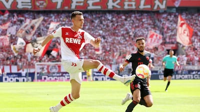 Dejan Ljubicic of Cologne fight for the ball on Saturday. Getty