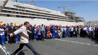 Jerome Valcke, the secretary-general of Fifa, kicks a ball during an inspection at the construction site of the Itaqueirao Stadium in Sao Paulo last month.