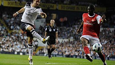 Tottenham Hotspur's Rafael van der Vaart, left, shoots and scores during their 3-3 draw with north London rivals Arsenal..