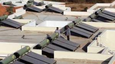 Solar water heaters, such as these in India, are coming to Musaffah.
