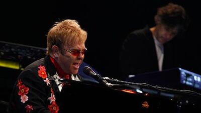 Elton John and his band perform at the Emirates Palace hotel in Abu Dhabi in 2008. Joseph J Capellan / The National