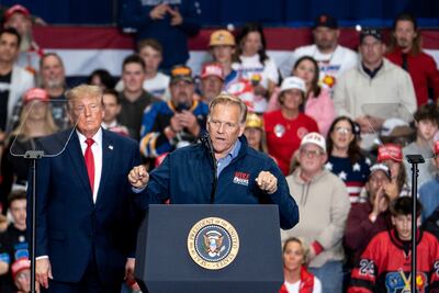 US President Donald Trump and former Representative Mike Rogers, a Republican from Michigan and US Senate candidate, in Port Huron, Michigan, on October 25. Bloomberg