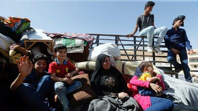 Syrian refugees prepare to return to Syria from the Lebanese border town of Arsal, Lebanon, on June 28, 2018. Mohamed Azakir / Reuters