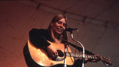 Joni Mitchell performs at the Central Park Music Festival in New York in 1969.