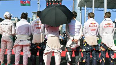Drivers stand on the grid before the start of the European Formula One Grand Prix at the Baku City Circuit on June 19, 2016 in Baku. Andrej Isakovic / AFP