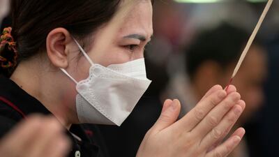 Prayers for the victims of a mass killing at the Young Children's Development Centre in Uthai Sawan, north-eastern Thailand. A former police officer shot and stabbed 37 people, many of them children, to death on Thursday. AP