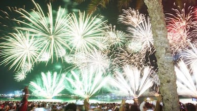 People admire the fireworks display at the Corniche. Christopher Pike / The National