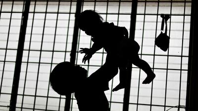 Filipino children play inside a school classroom turned into a temporary evacuation centre in Cavite City as they wait out Typhoon Gaemi, also known as Carina. On July 23, the weather system headed north to threaten Taiwan. EPA