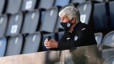 Atalanta manager Gian Piero Gasperini watchesfrom the stands. AFP