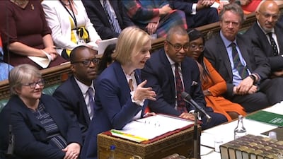 UK Prime Minister Liz Truss speaks in Parliament, as Foreign Secretary James Cleverly, to the right of her, looks on. AFP