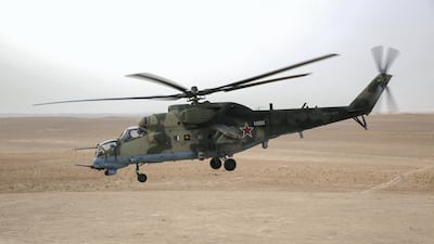 A Russian Mil Mi-24 "Hind" attack helicopter flying in the eastern Syrian region of Deir Ezzor. AFP