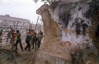 Indian Hindu fundamentalists attack the wall of the 16th century Babri mosque with iron rods at a disputed holy site in the city of Ayodhya in 1992. AFP