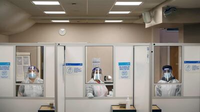 Health workers prepare to assist at an NHS Covid-19 testing unit at the Civic Centre in Uxbridge, Hillingdon, west London. AFP