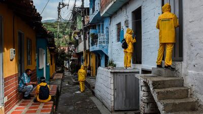 Local authorities interview residents at the Santa Cruz neighbourhood in Medellin, Colombia during the Covid-19 pandemic. Authorities placed the Santa Cruz neighbourhood under strict lockdown after an outbreak of the virus. AFP