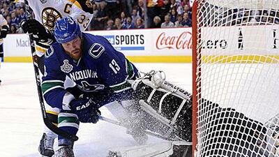 Raffi Torres, front, was unemployed in the summer, but the Vancouver Canucks decided to take a chance on him. He scored the last minute winner in Game 1 of the Stanley Cup Finals.