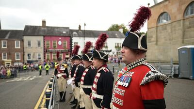 Members of the military await the arrival of King Charles at Hillsborough Castle. Getty Images