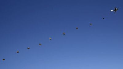 Troops from the Japan’s Ground Self-Defence Force 1st Airborne Brigade jump from a C-1 transport plane during an annual new year military exercise at Narashino exercise field in Funabashi, east of Tokyo. Toru Hanai / Reuters