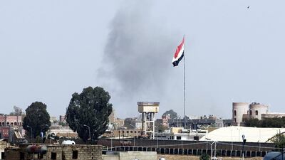 Smoke rsises from a military base in Sanaa following air strikes carried out by the Saudi-led coalition November 13, 2015. Yahya Arhab / EPA