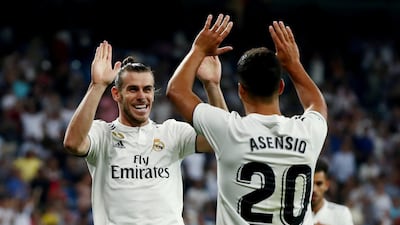 Real Madrid's Gareth Bale celebrates scoring their second goal with Marco Asensio. Reuters