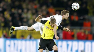 Borussia Dortmund player Oliver Kirch, left, and Real Madrid player Asier Illarramendi challenge for the ball during their Champions League match on Tuesday night. Frank Augstein / AP / April 8, 2014