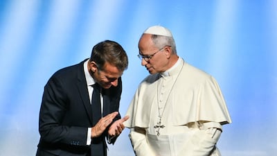 Pope Leo XIV, right, speaks with French President Emmanuel Macron in Metz, north-eastern France. AFP