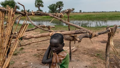 A child in Panthoy village, near Malualkon in Northern Bahr El Ghazal. This state is usually spared extreme flooding, but now, houses and crops have been swamped.