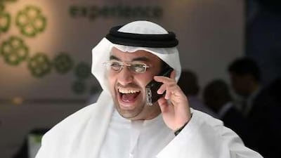 A local man laughing while on a mobile phone during the third day of Gitex Technology Week, held at the Dubai International Convention and Exhibition Centre.