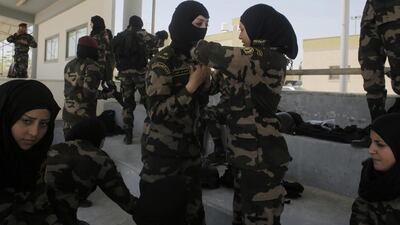 The female Presidential Guards recruits were picked from last year’s graduating class of Independence University, a four-year security academy in Jericho that trains future officers. Ahmad Gharabli / AFP. Ammar Awad / Reuters