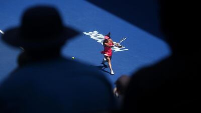 Agnieszka Radwanska of Poland plays a backhand return to Carla Suarez Navarro of Spain during their quarterfinal match at the Australian Open tennis championships in Melbourne, Australia, Tuesday, Jan. 26, 2016.(AP Photo/Rafiq Maqbool)
