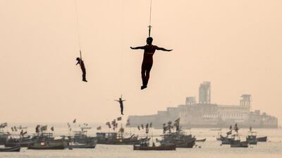 Indian Navy marine commandos demonstrate their rescue operation skills during Navy Day celebrations in Mumbai, India. The Indian Navy celebrates Navy Day to commemorate the Indian Navy attack on Karachi harbour during the Indo-Pakistan war in 1971. Divyakant Solanki / EPA